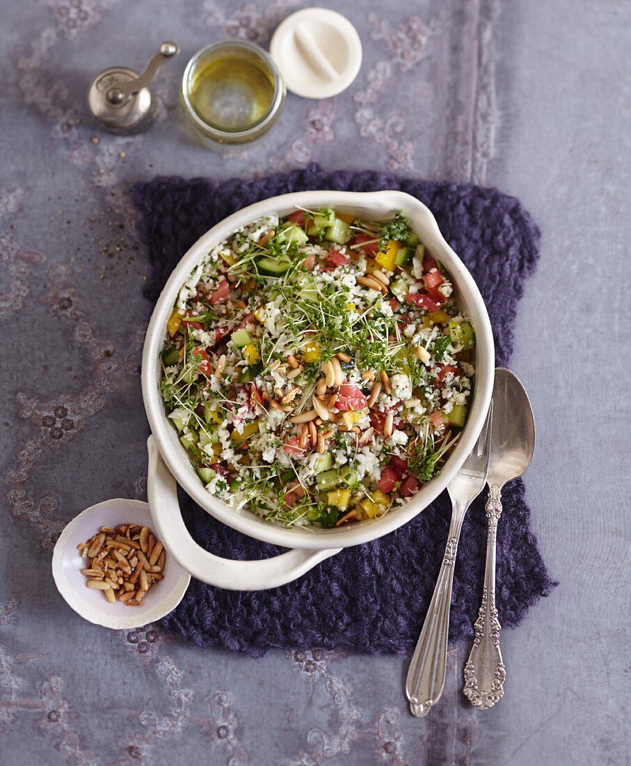 Vegetarian cauliflower tabouleh with cress and pine nuts