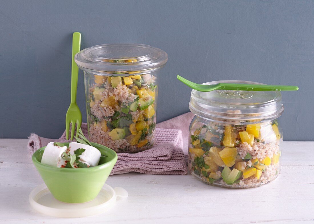 Buckwheat salad with avocado in glass jars