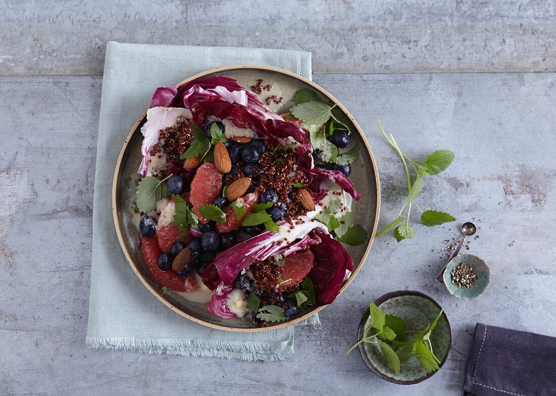 A detox salad with quinoa, pink grapefruit and blueberries
