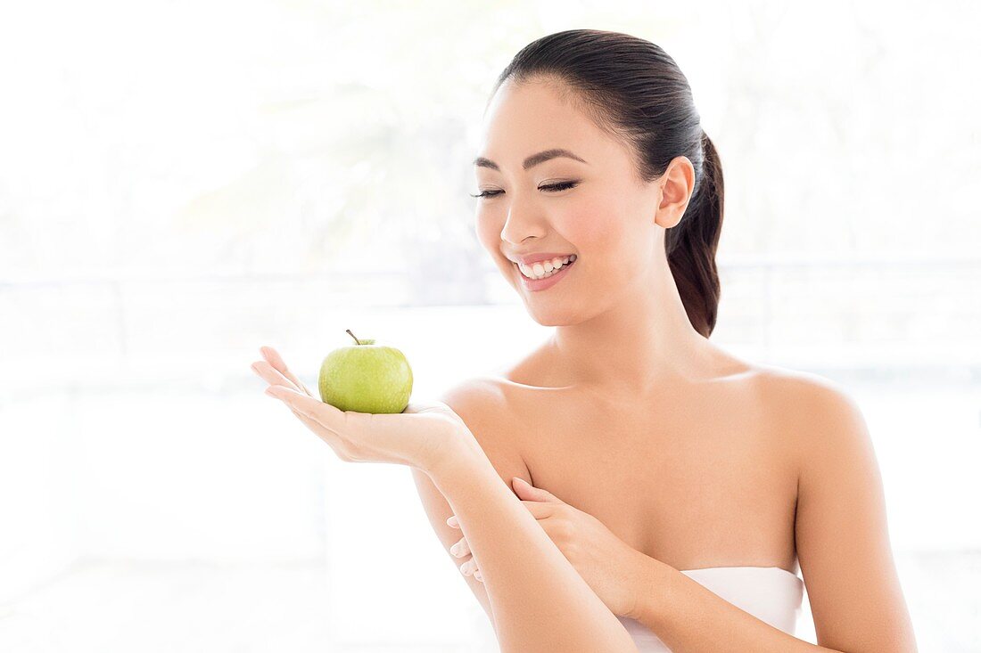 Woman holding apple