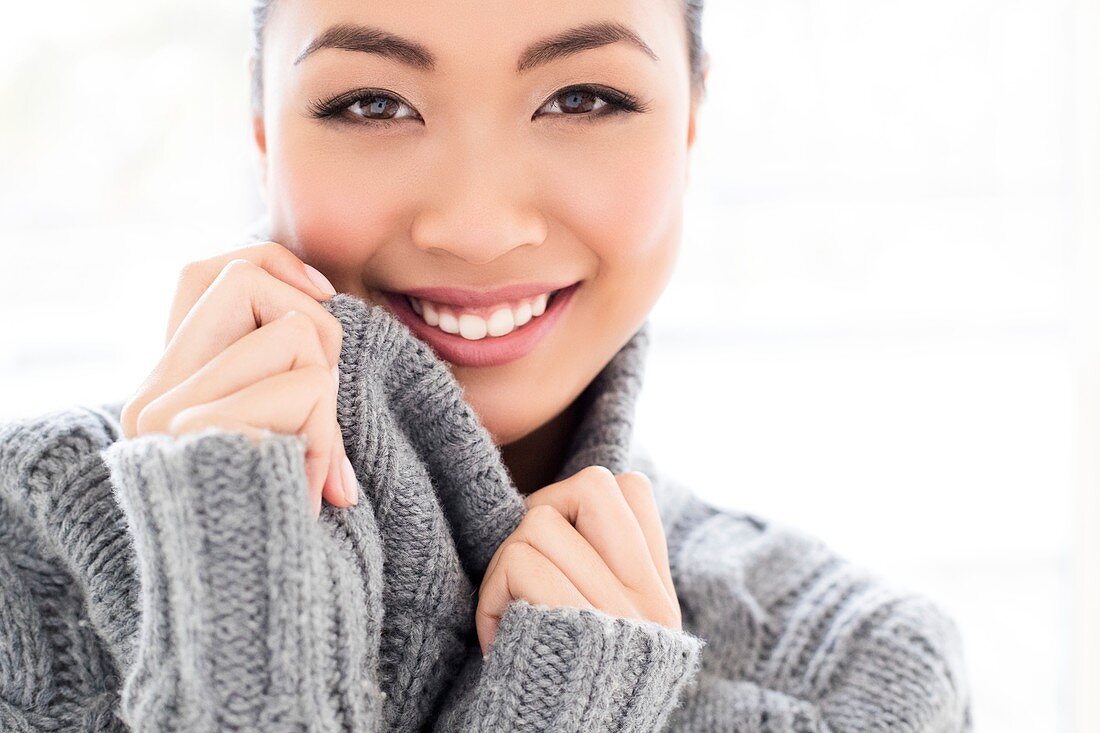 Woman wearing grey knitted sweater