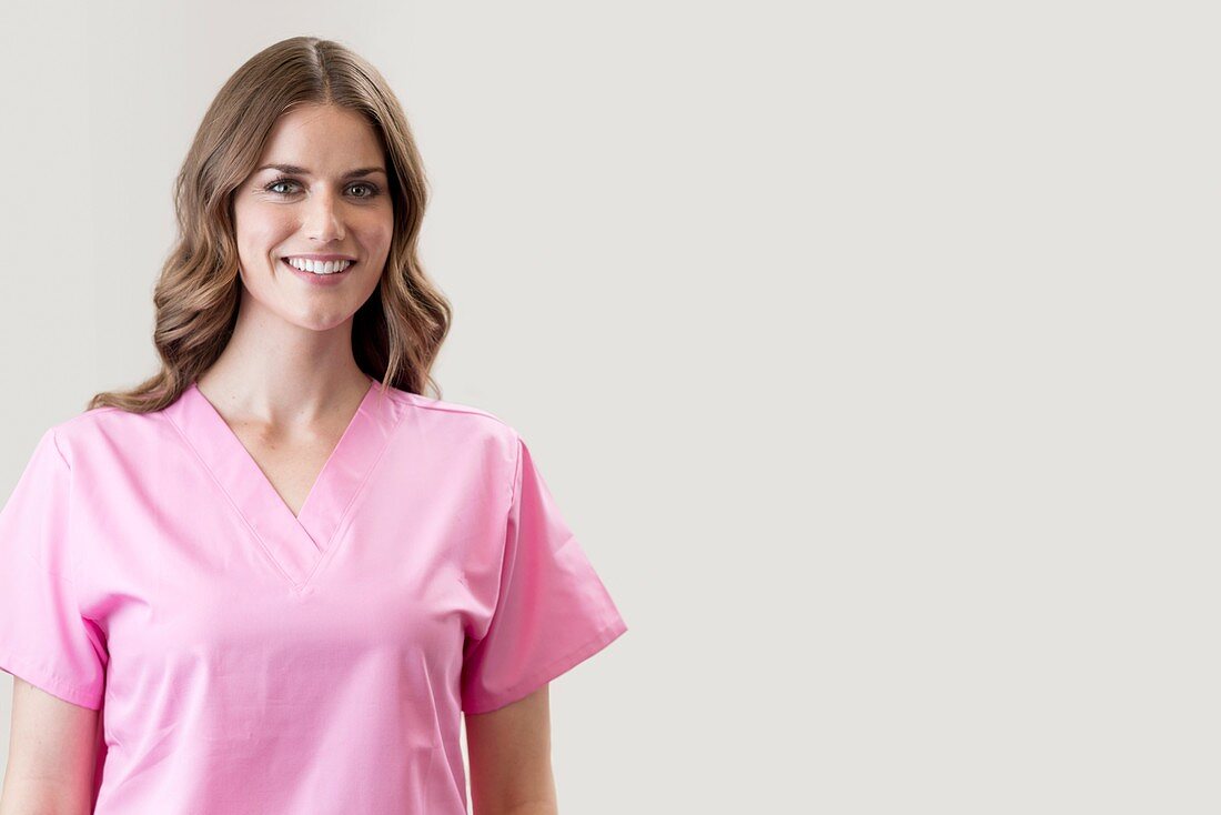 Female nurse smiling towards camera