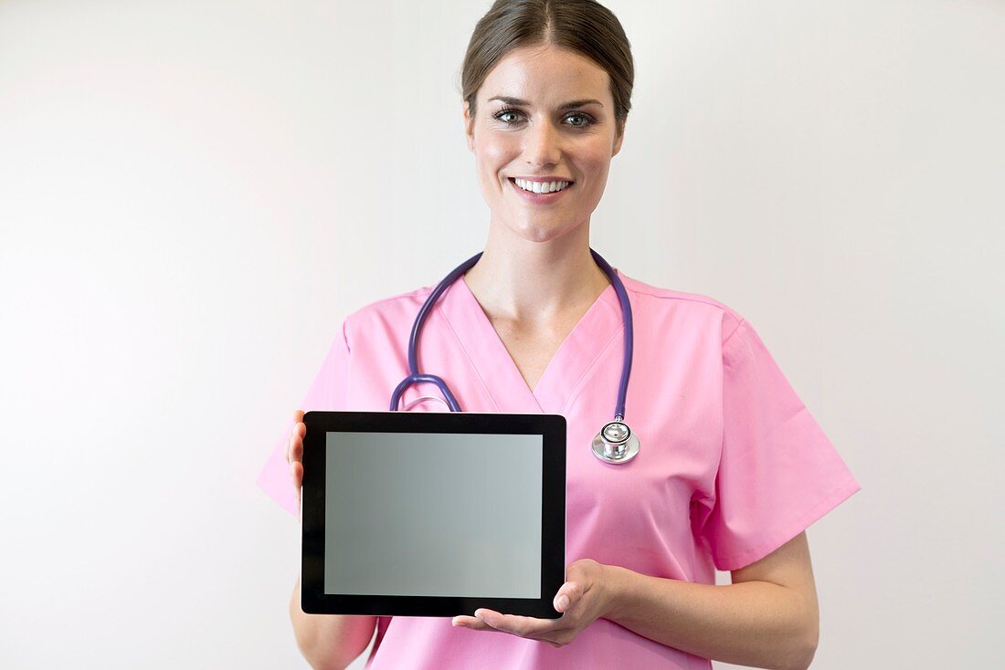 Female nurse holding digital tablet