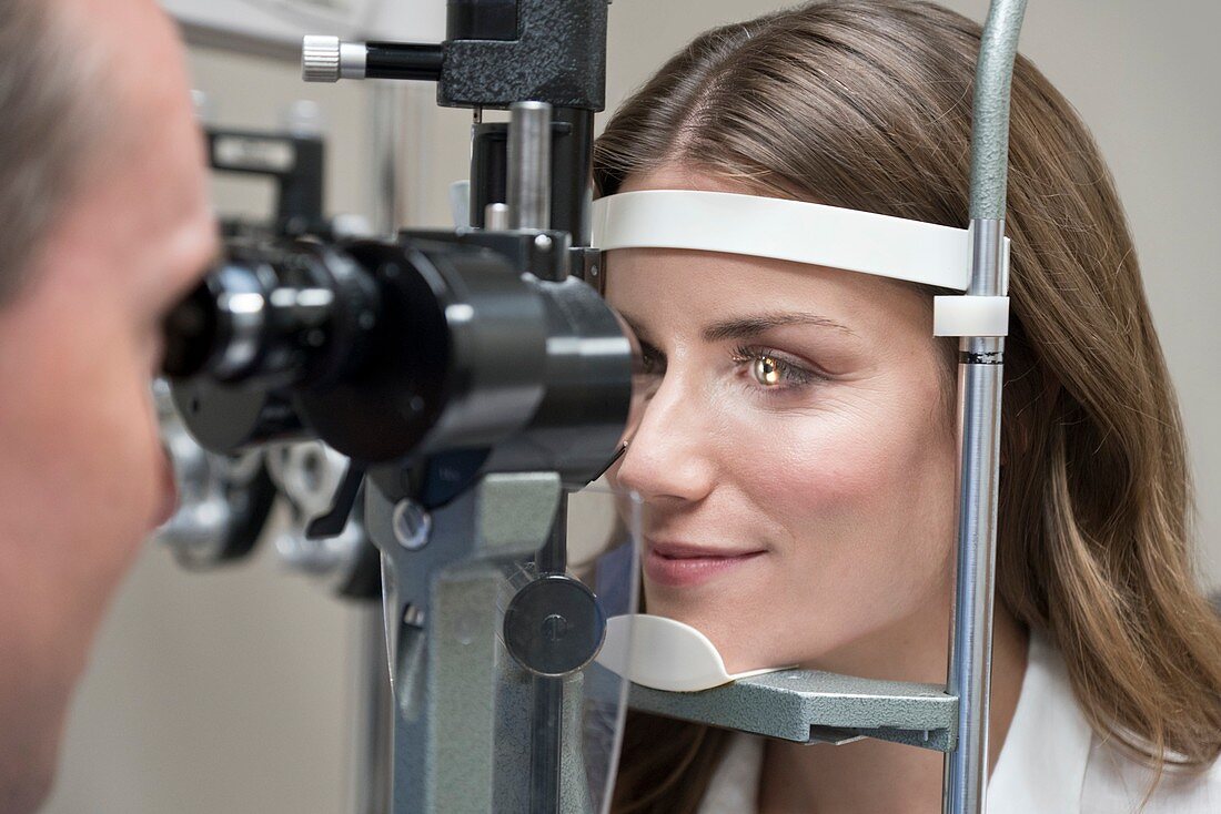 Mid adult woman having eye test