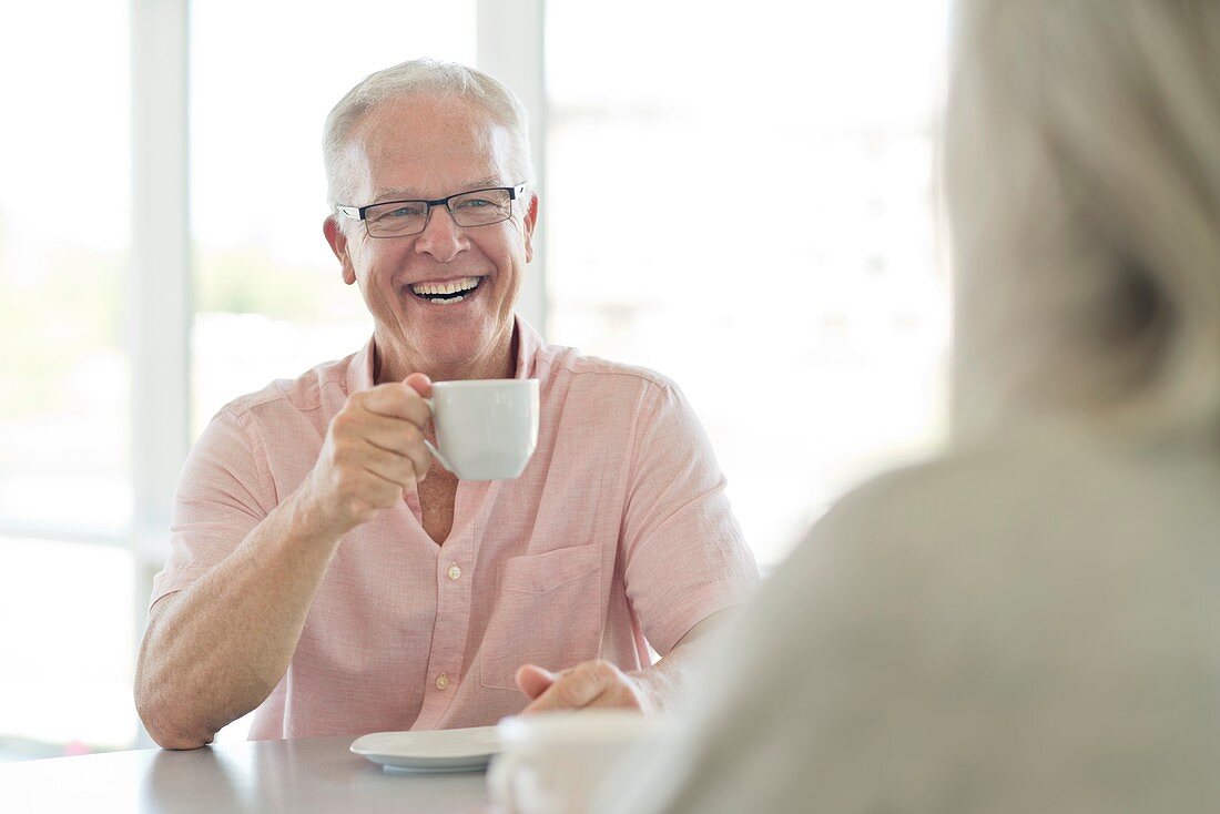 Senior man with cup of tea