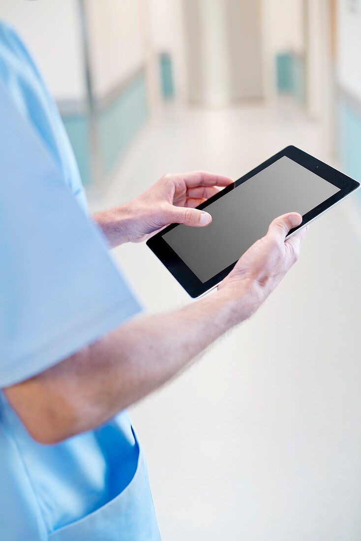 Surgeon using tablet