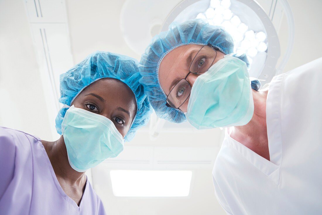Surgeons looking towards camera