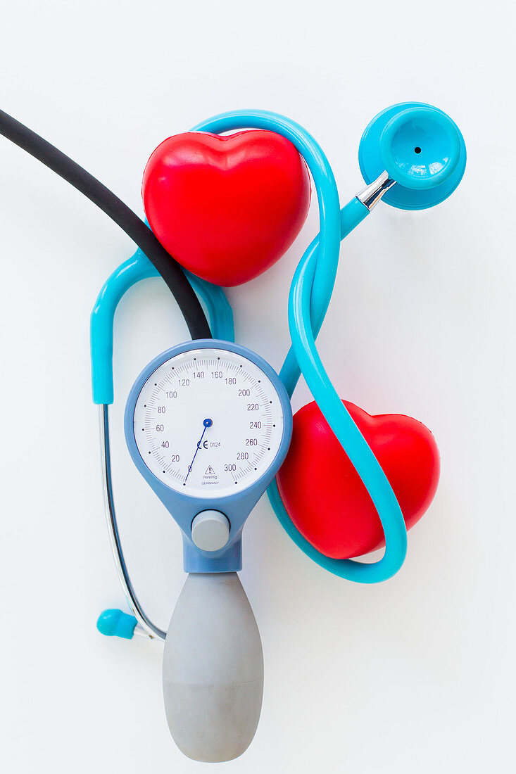 Stethoscope surrounding plastic hearts