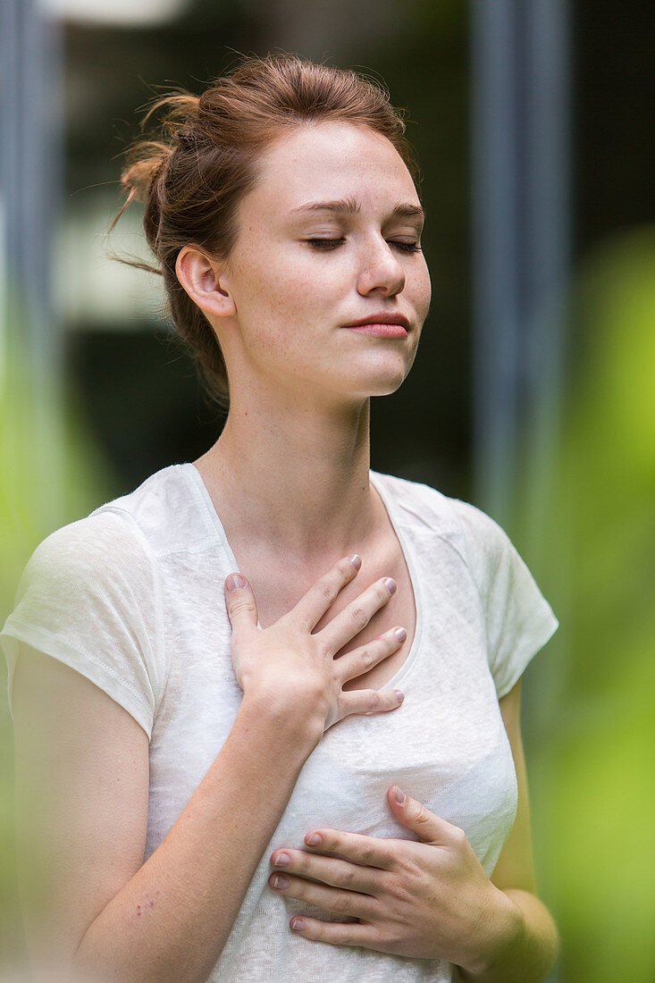 Woman practicing respiratory exercises