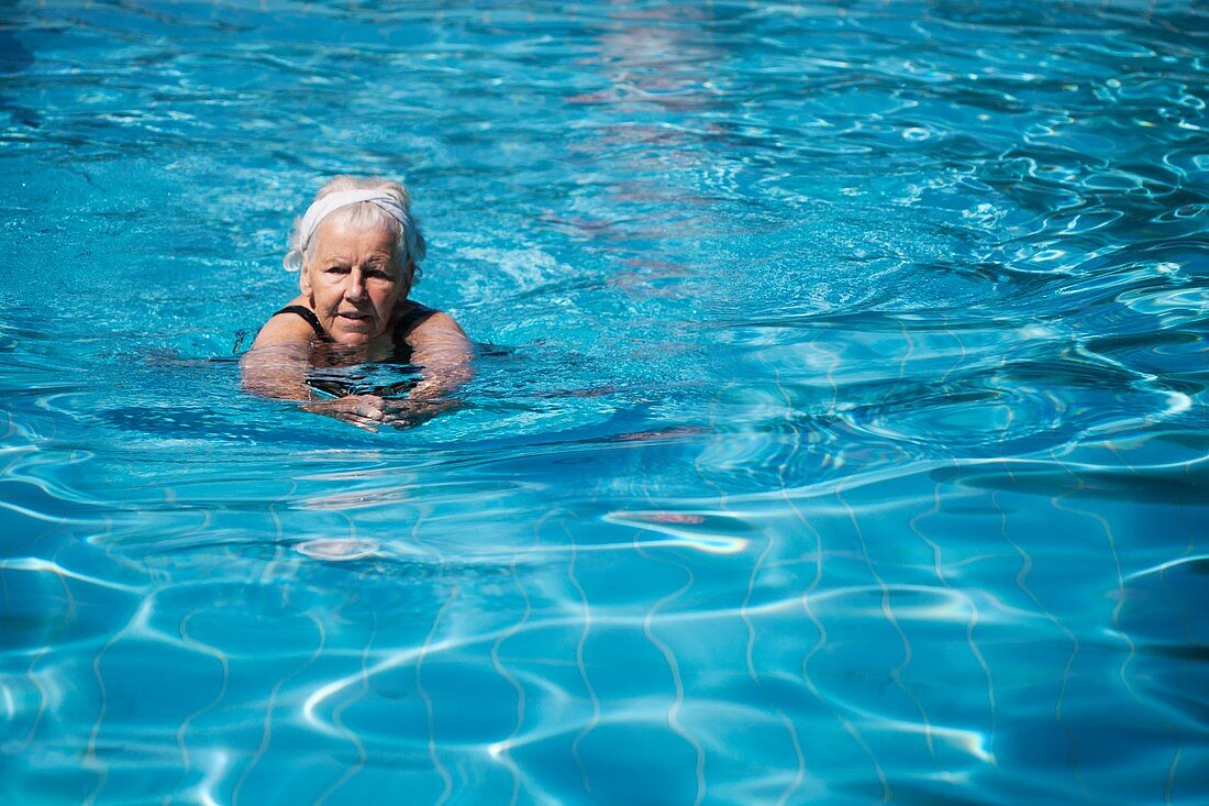 Elderly woman swimming