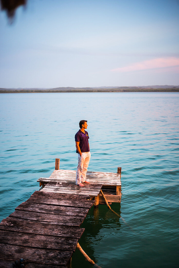 Man standing on lakeside