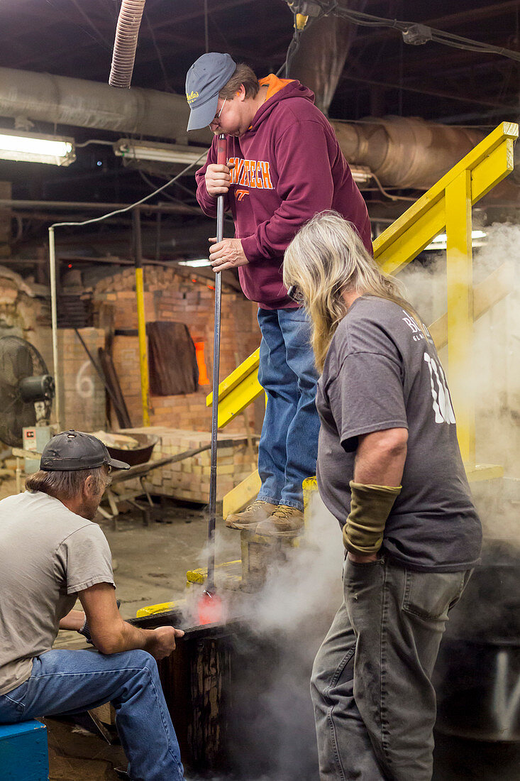 Glassblower using a blowpipe