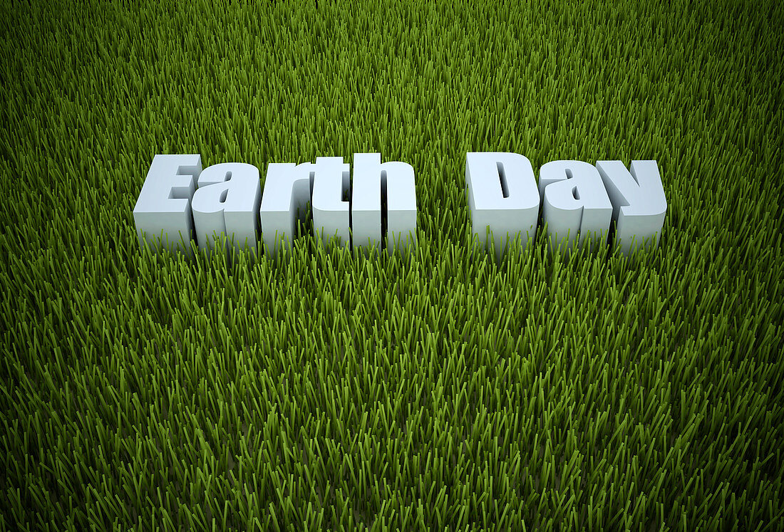 Earth day written in green grass