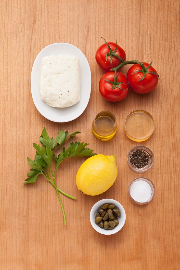 Ingredients for halloumi with tomato and caper sugo