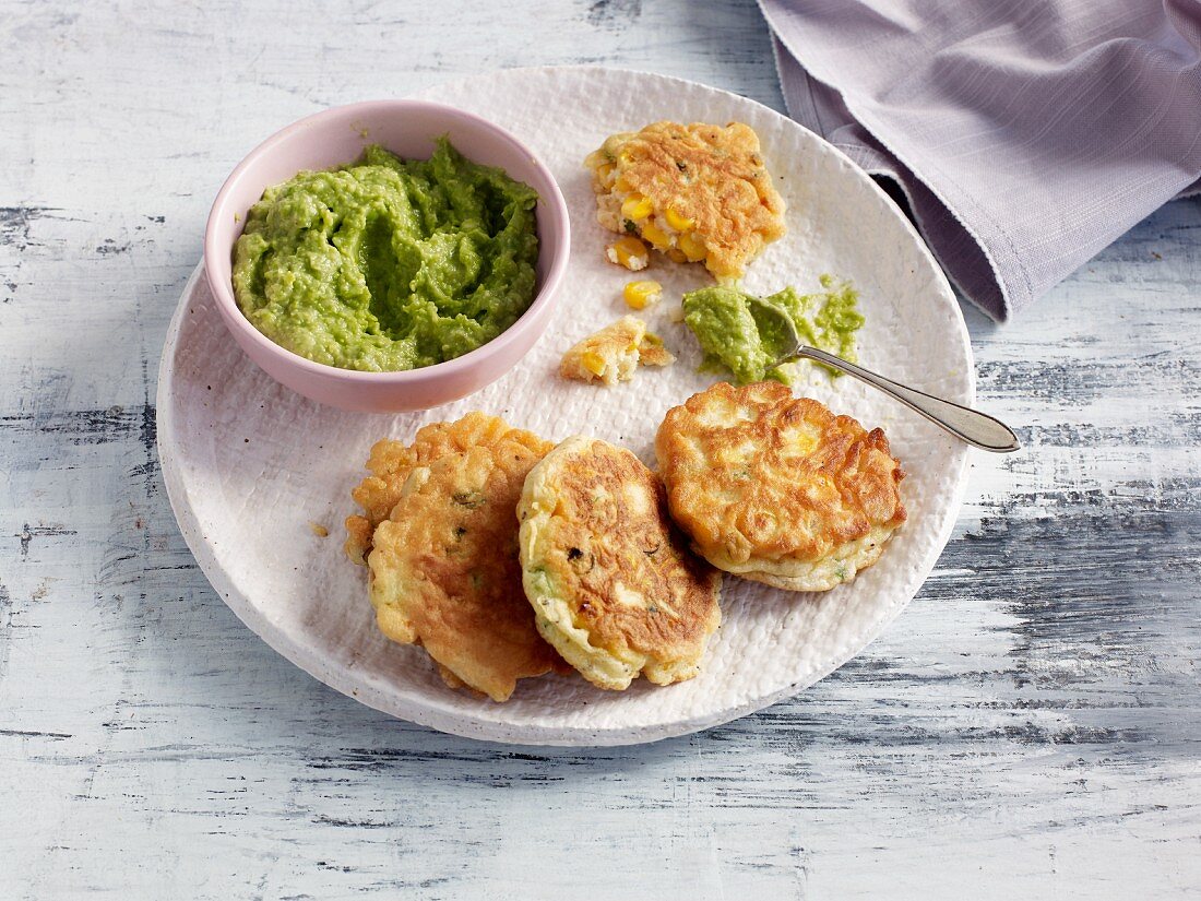 Quick and easy corn fritters with pea guacamole