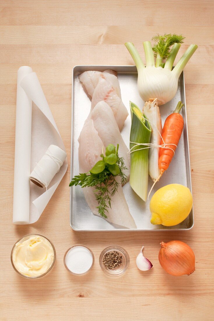 Ingredients for fish fillet with vegetables cooked in parchment paper