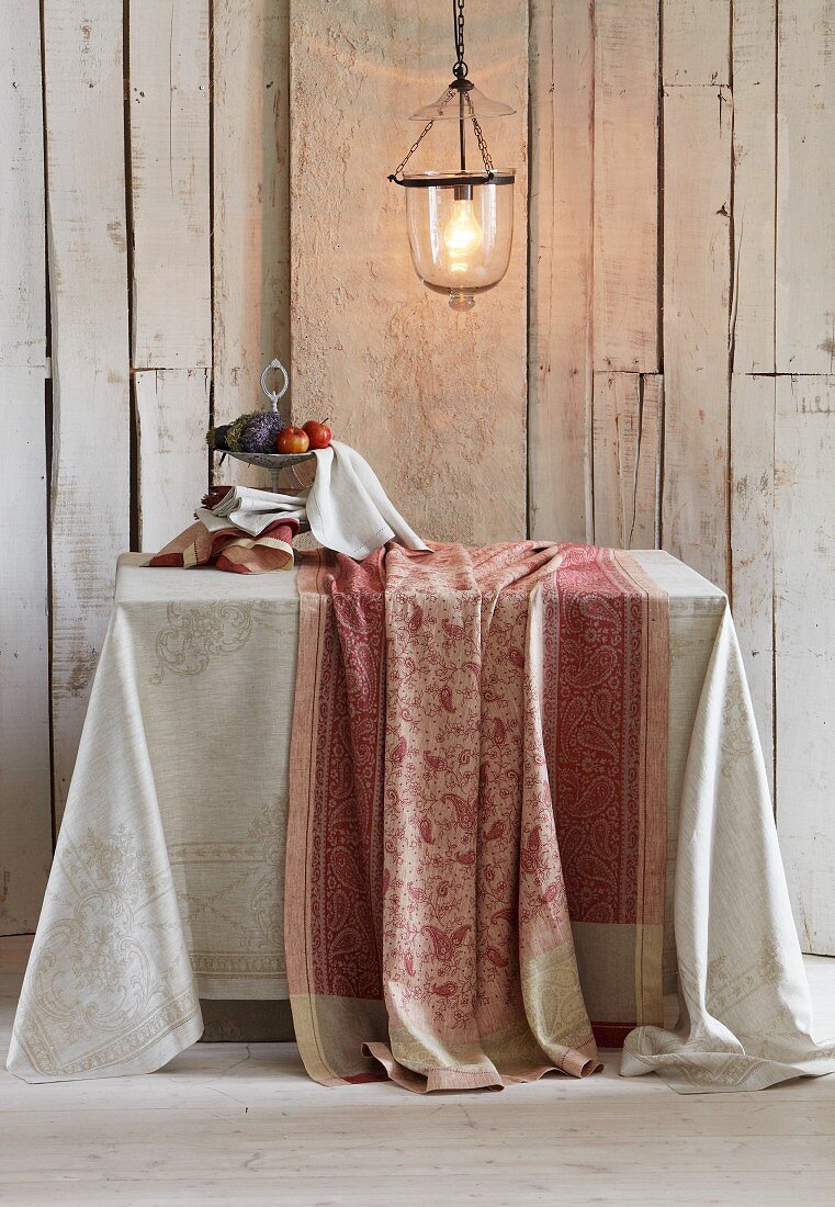 Paisley table linen against of rustic board wall