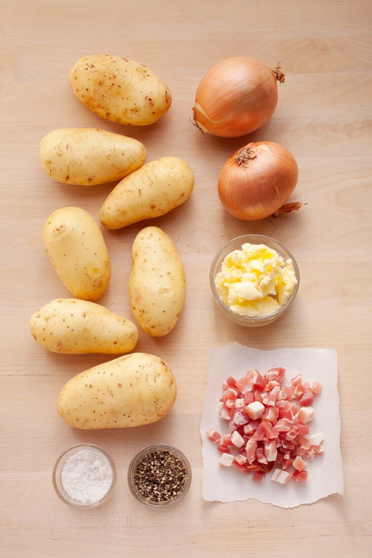 Ingredients for fried potatoes with onion and bacon