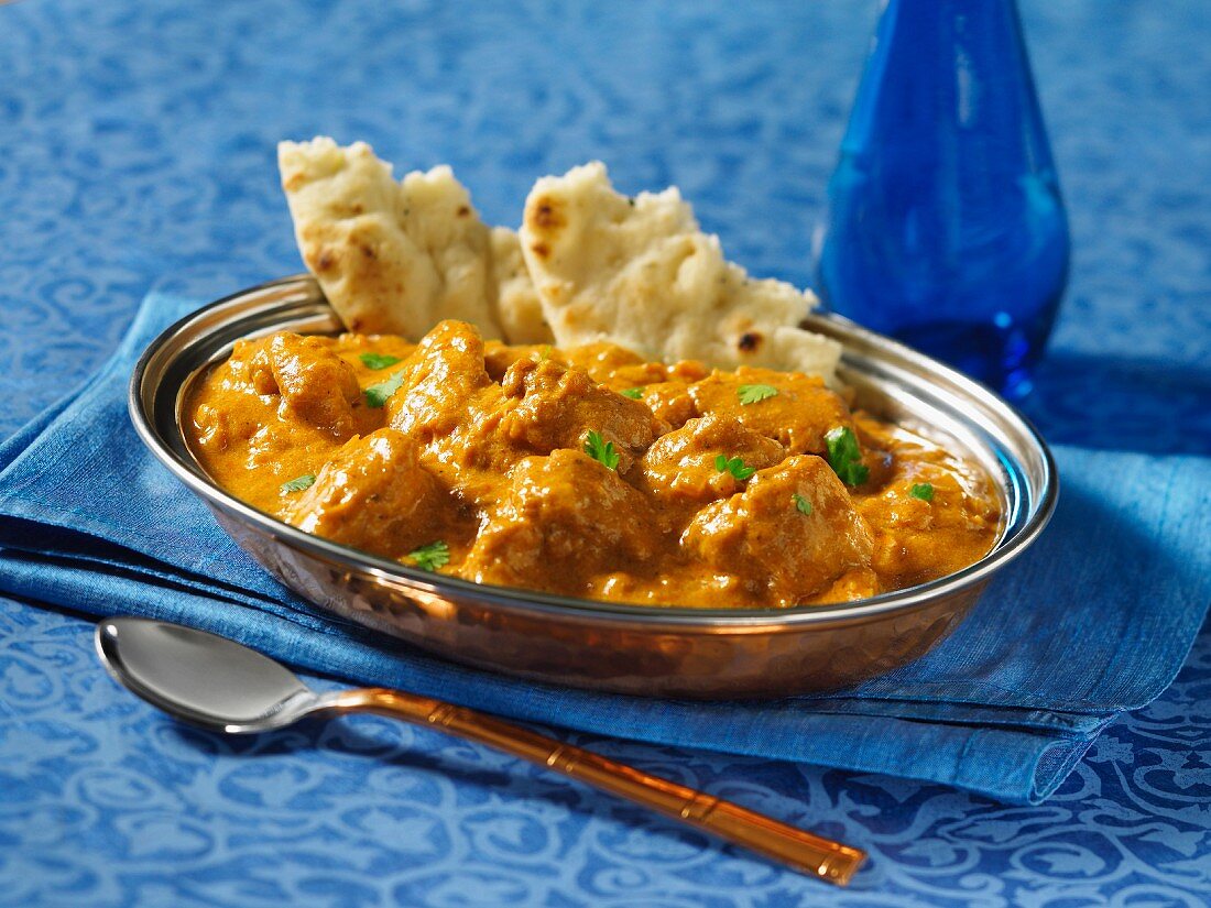 Indian butter chicken (Murgh Makhani) with naan bread