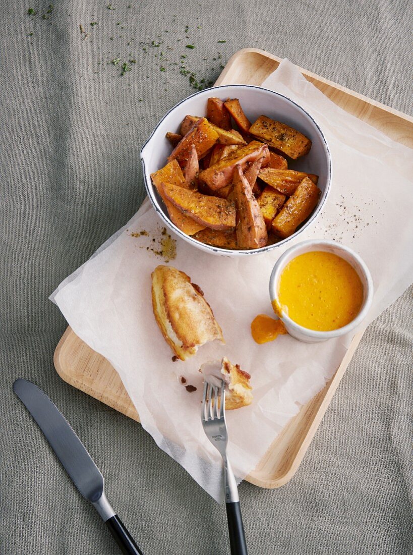 Fish in coconut batter with sweet potato wedges