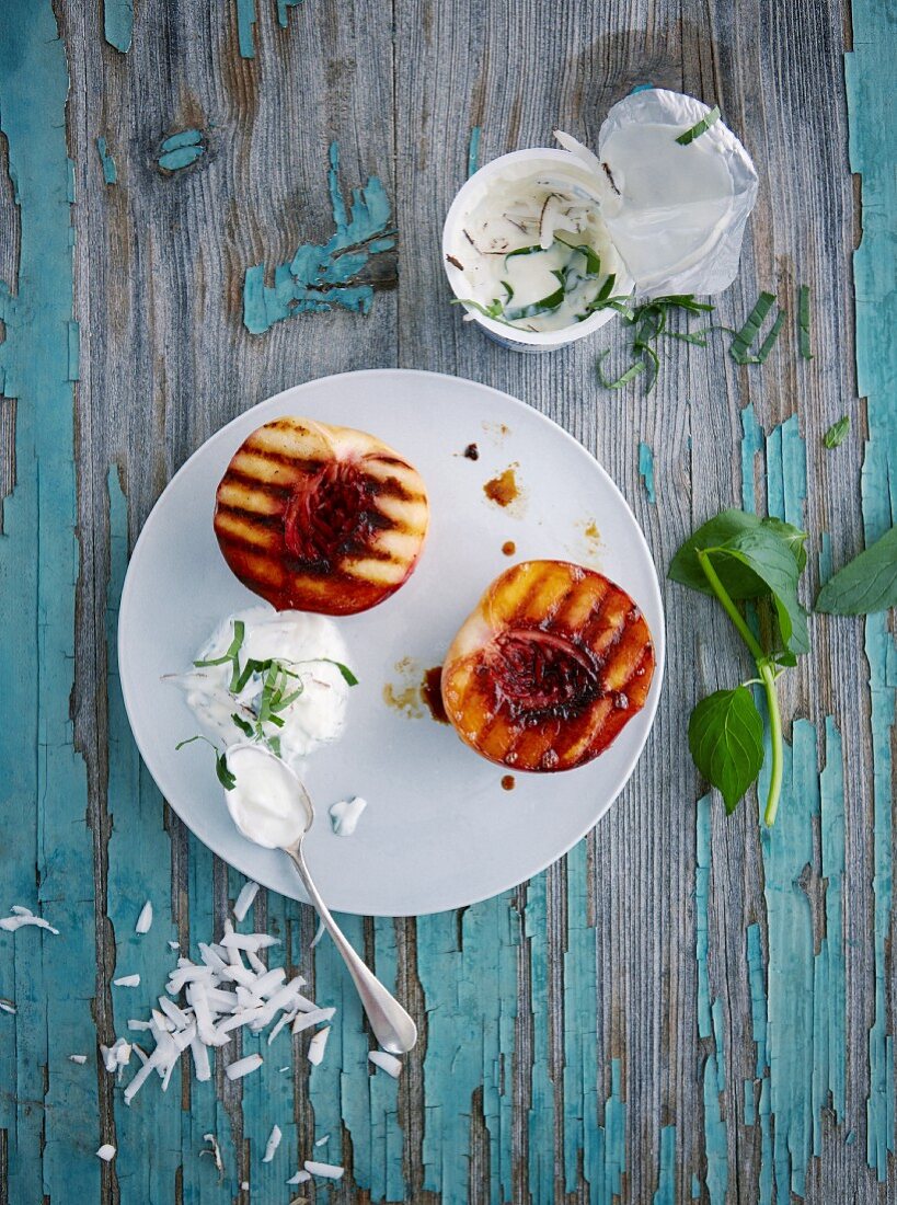 Grilled peach halves with coconut and mint yoghurt