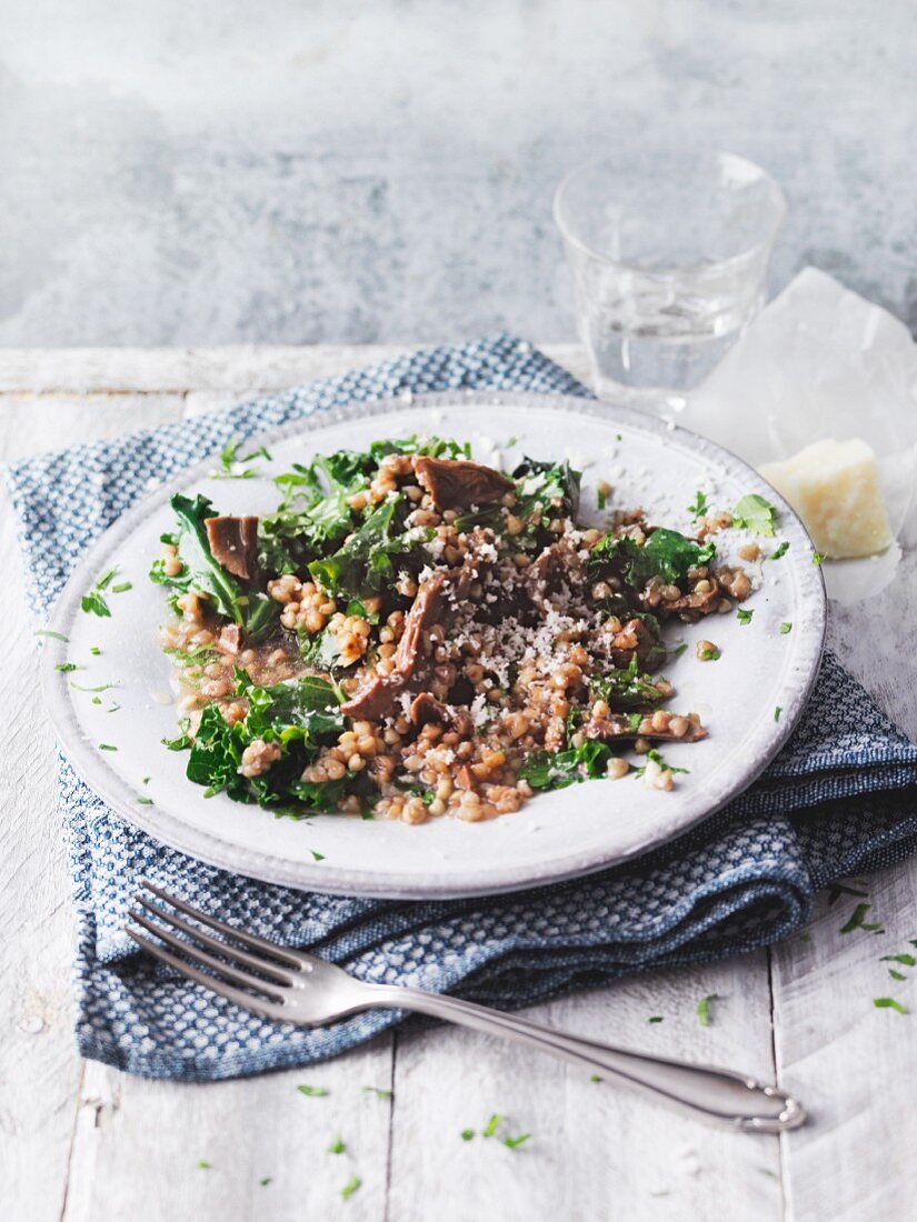 Vegetarian buckwheat and kale risotto with porcini mushrooms (Sirtfood)