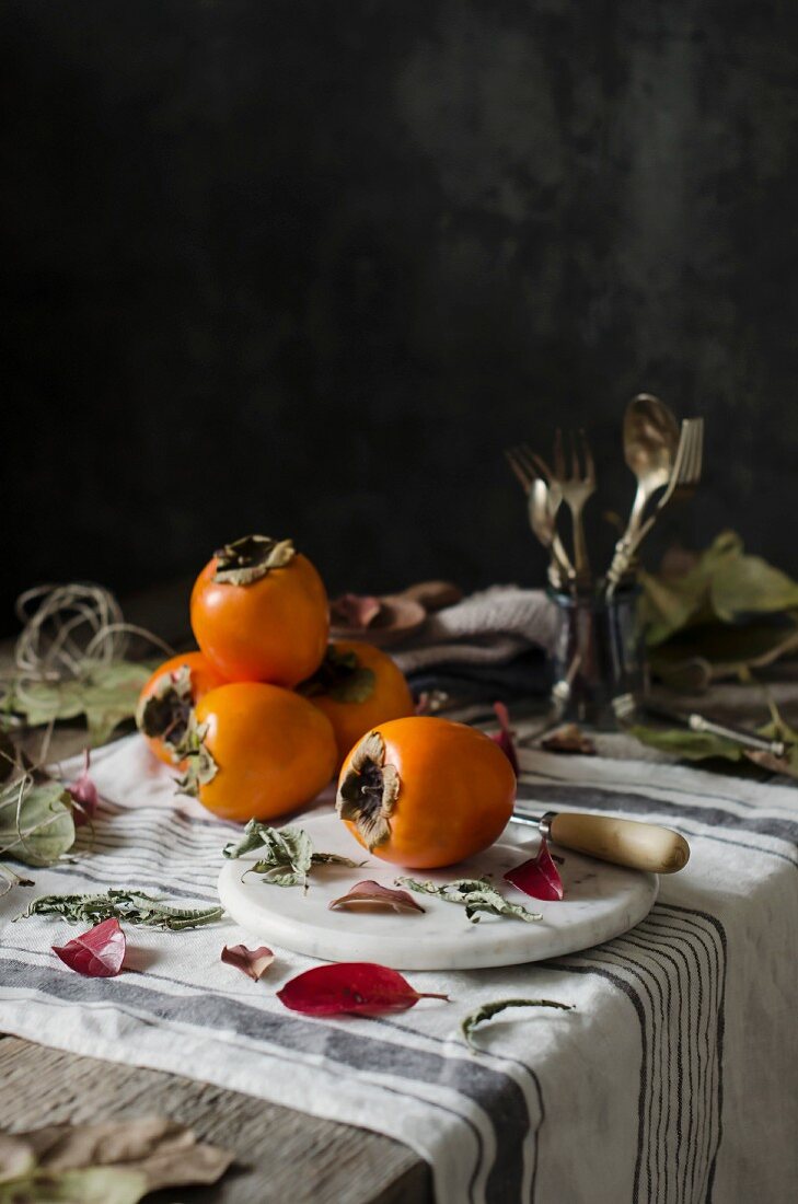 Fresh persimmons on a kitchen table