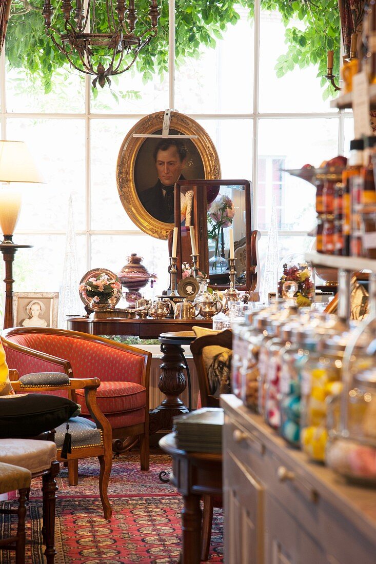 Cafe decorated with antique furniture, paintings and flea-market finds