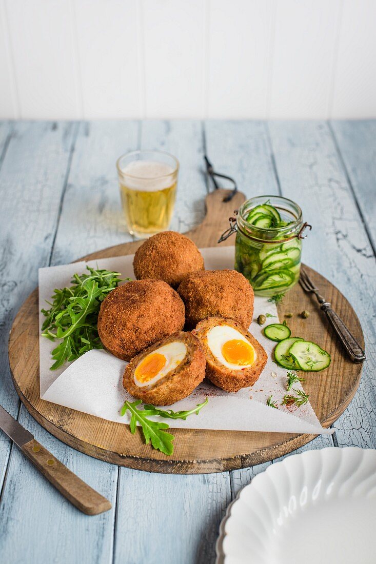 Scotch eggs with chorizo, peppers and cucumber relish