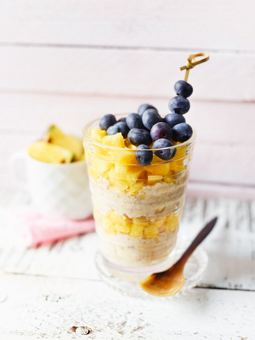 A breakfast cup with quinoa and pineapple