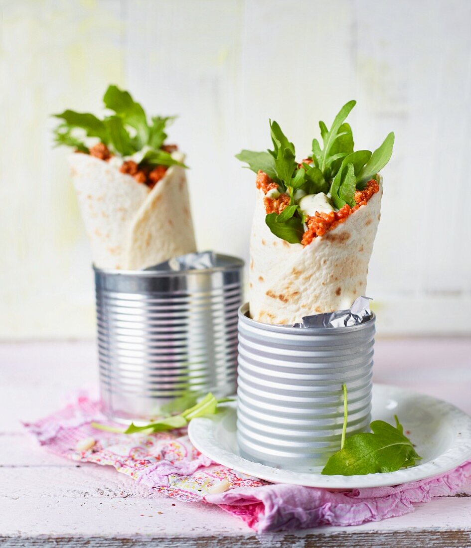 Lahmacun style wraps with rocket served in tin cans