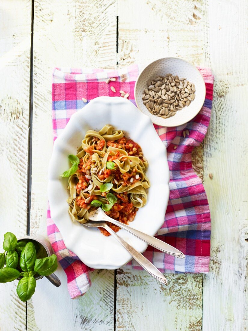 Ribbon noodles with lentil bolognese and sunflower seeds
