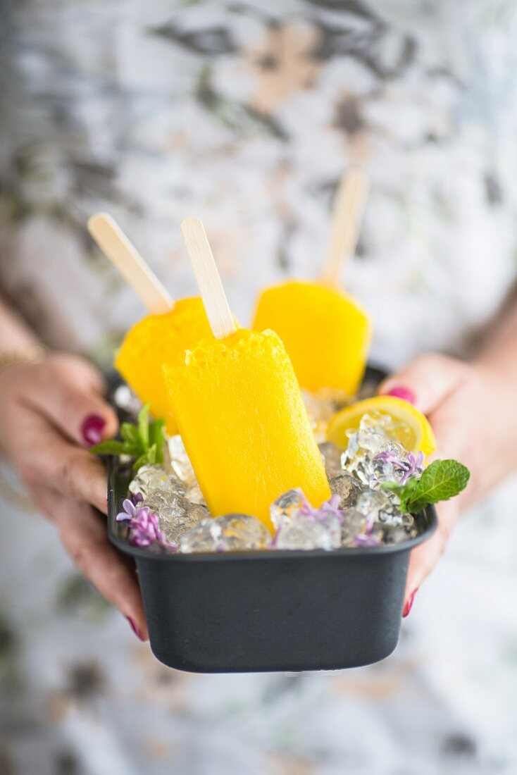 Mango lemon ice popsicles