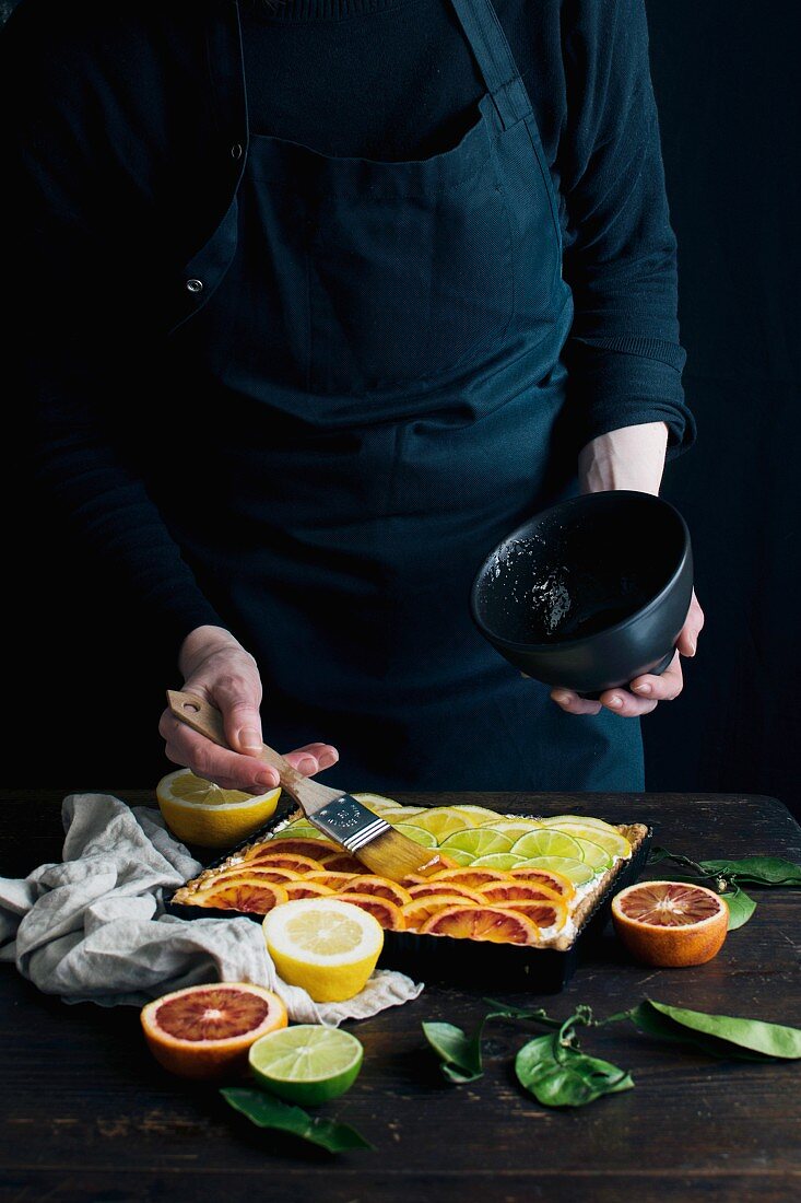 Glazing a citrus fruit torte