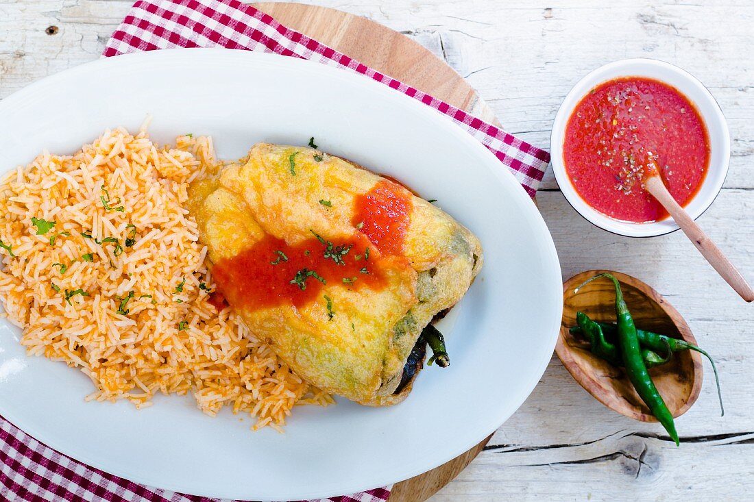 Chile Relleno (stuffed peppers with tomato sauce and red rice, Mexico)