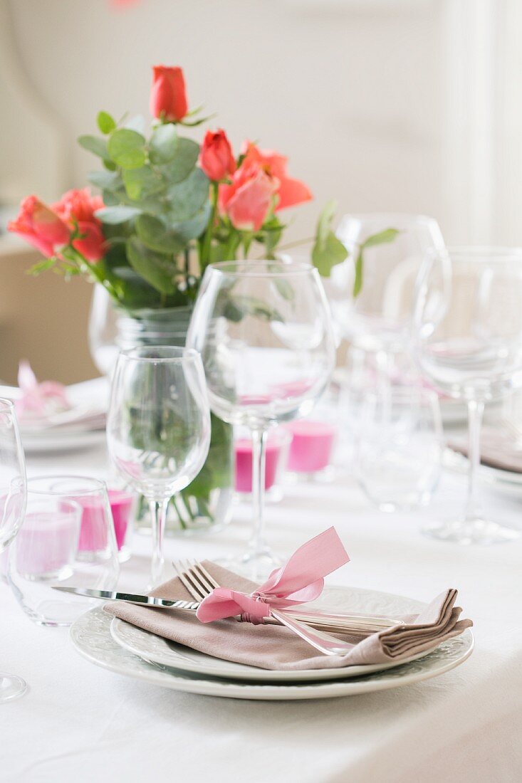 A table set with roses and candles