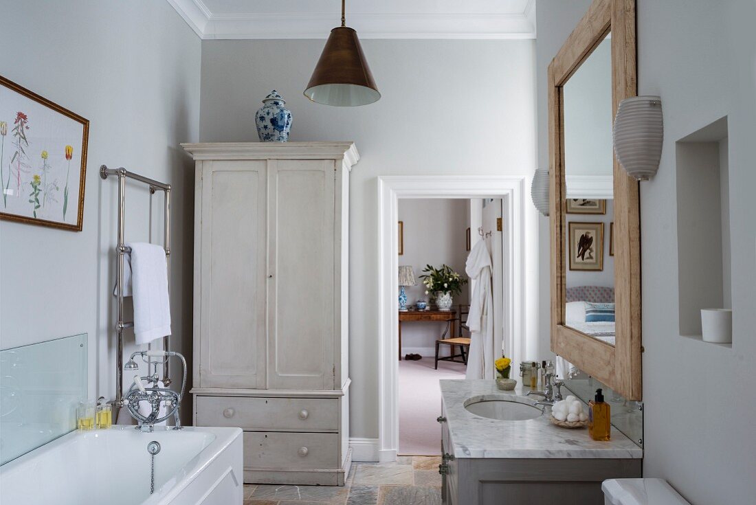 Wardrobe and stucco ceiling in vintage-style bedroom