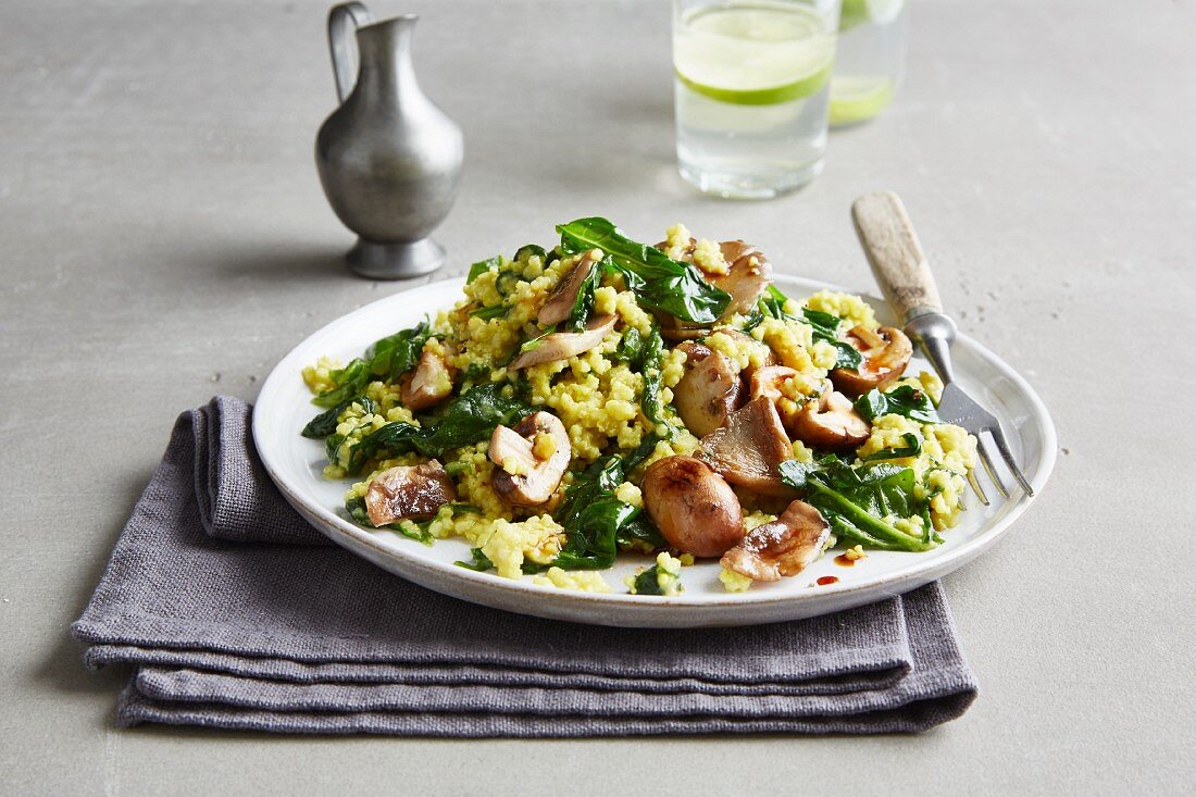 Vegan millet curry with spinach and mushrooms