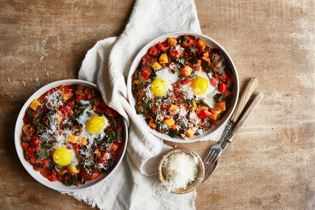 A potato dish with Swiss chard and fried eggs