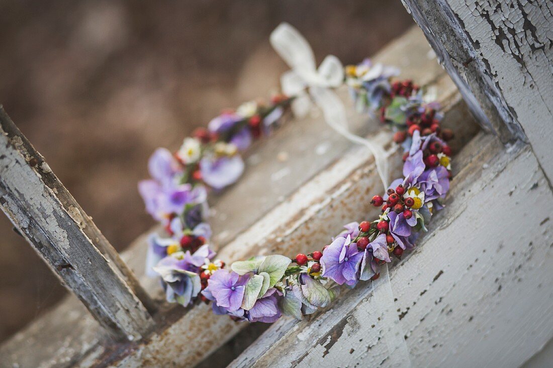 Floral wreath in weathered window frame
