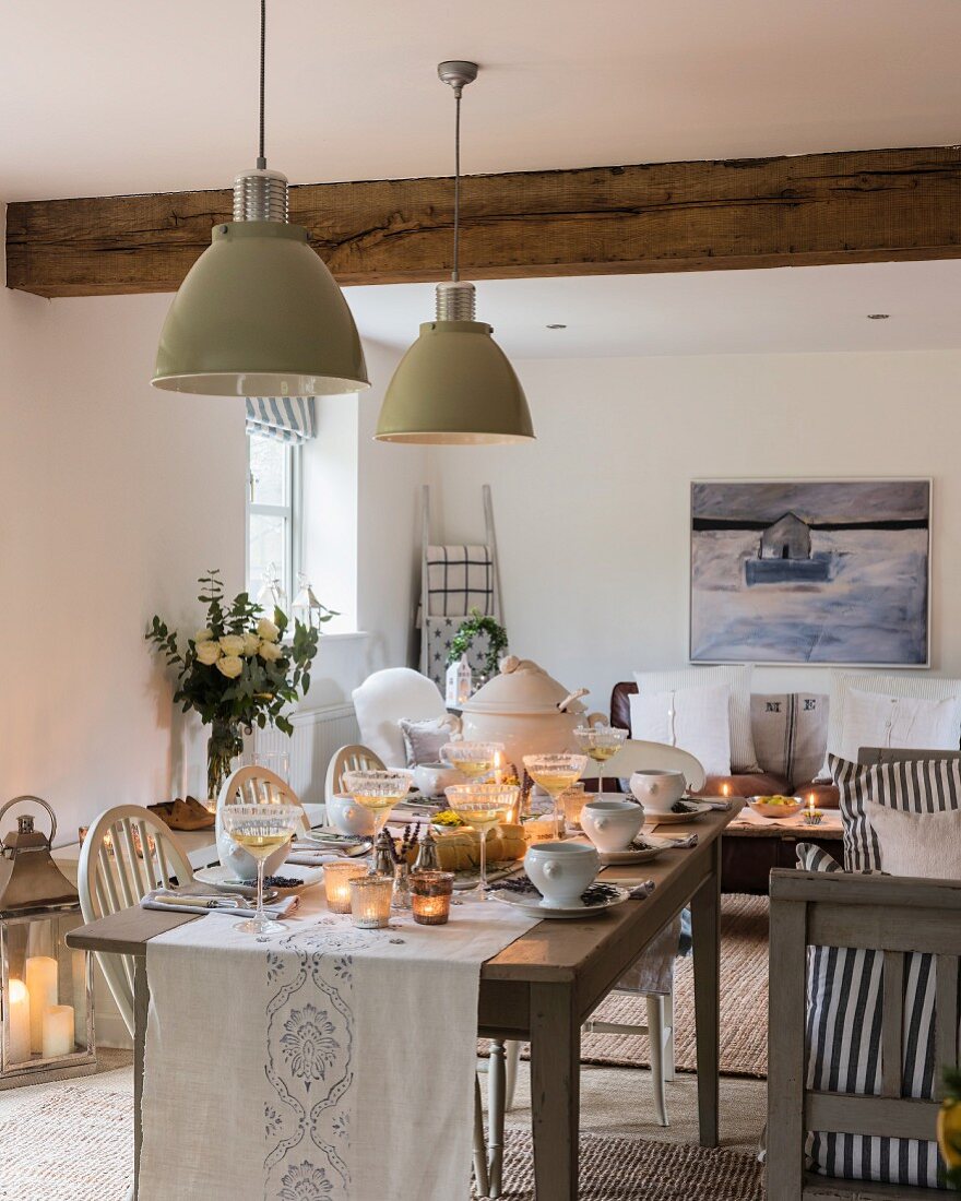 Festively set table decorated with candles