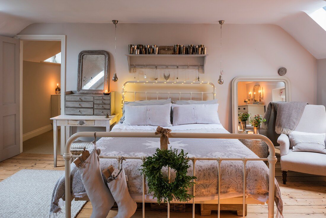 Christmas decorations in romantically lit bedroom