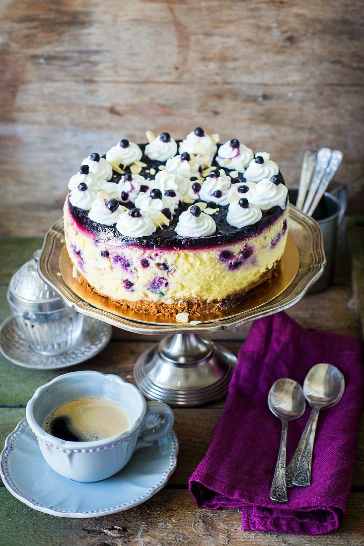Cheesecake topped with blueberries and cream
