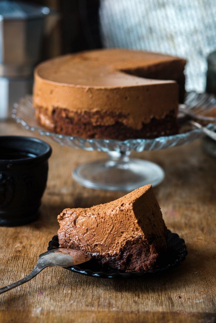 Chocolate mousse cake being cut