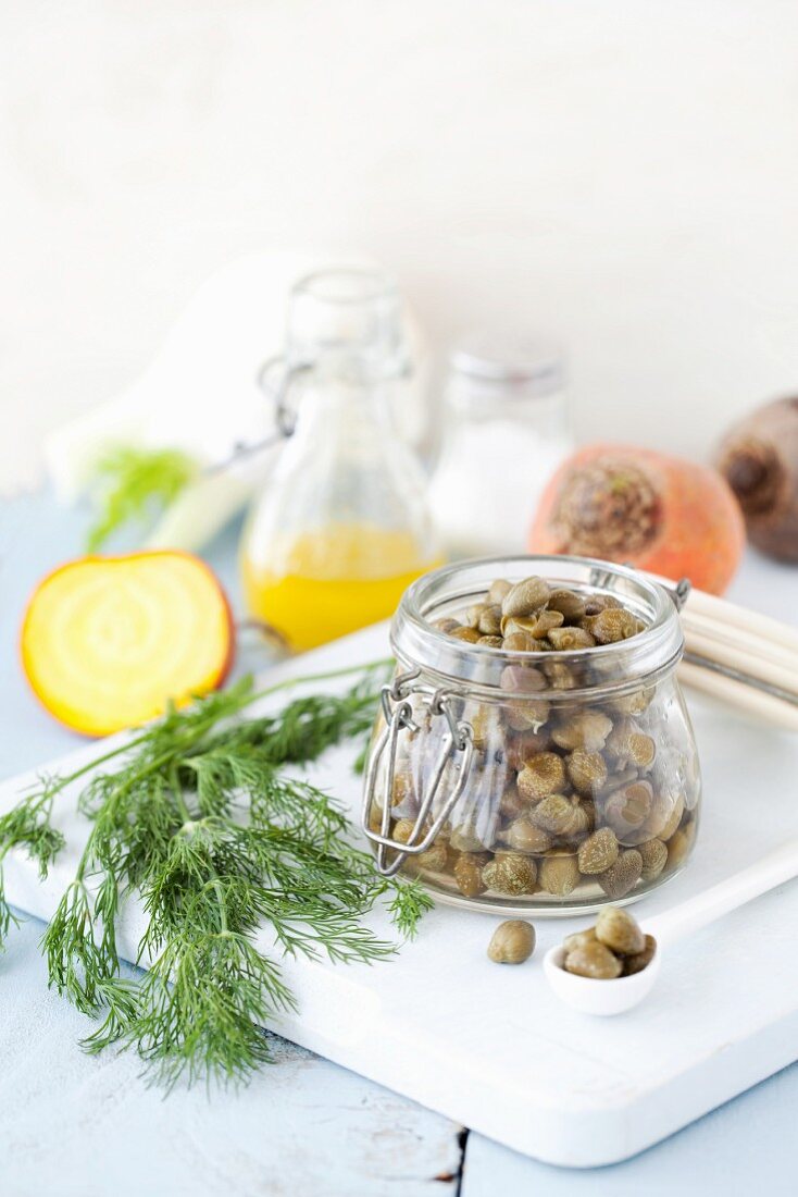 A jar of capers with dill