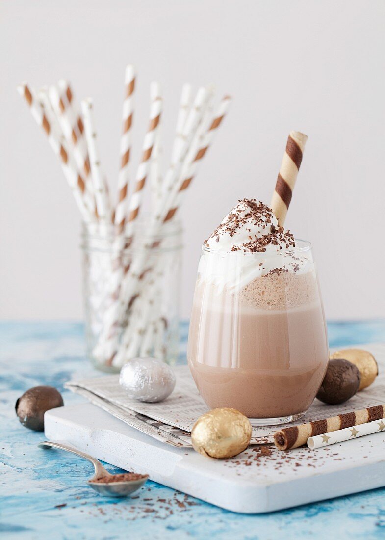 Chocolate Milkshake with whipped cream chocolate flakes foil wrapped chocolate eggs