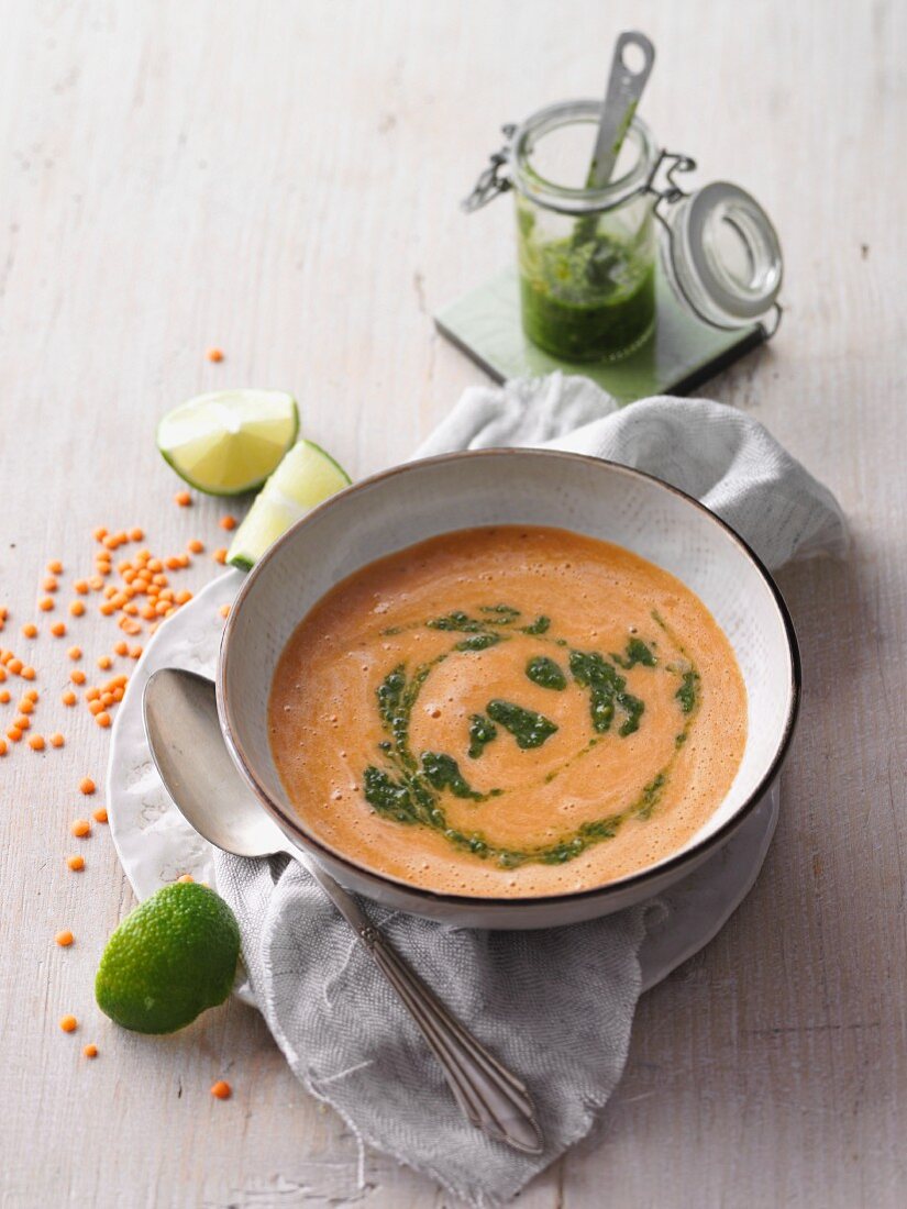 Red lentil soup with almond and herb pesto