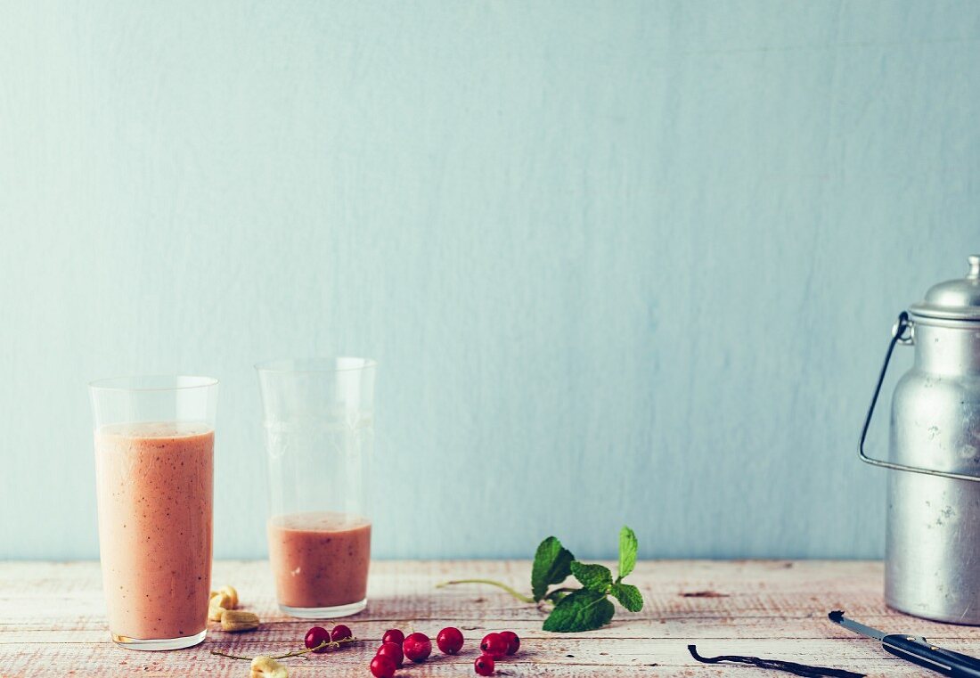 Redcurrant and soya smoothie with peaches and cashews