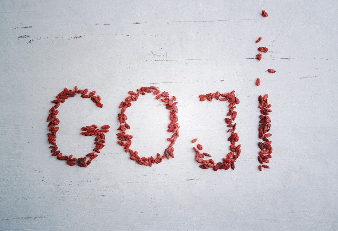 The word 'goji' spelled out in goji berries