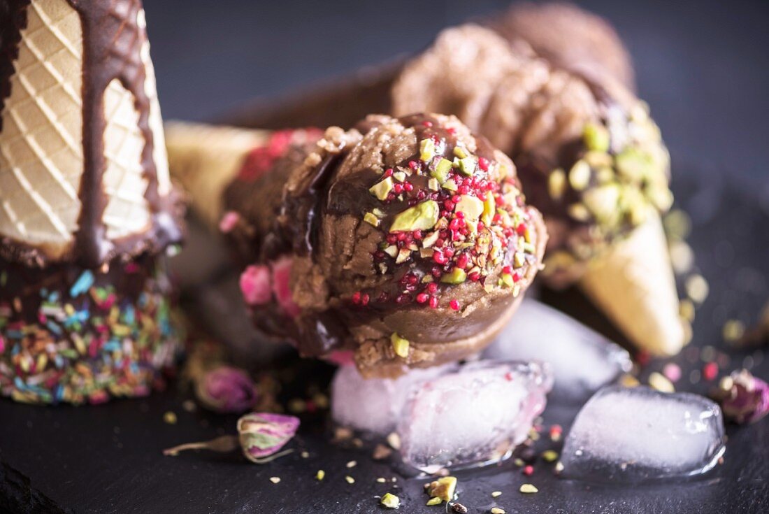 Close up to ice creams with sliced pistachios